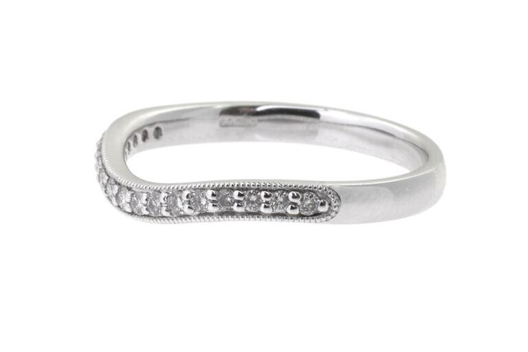 Shaped Diamond Half Eternity Ring in platinum Size: N