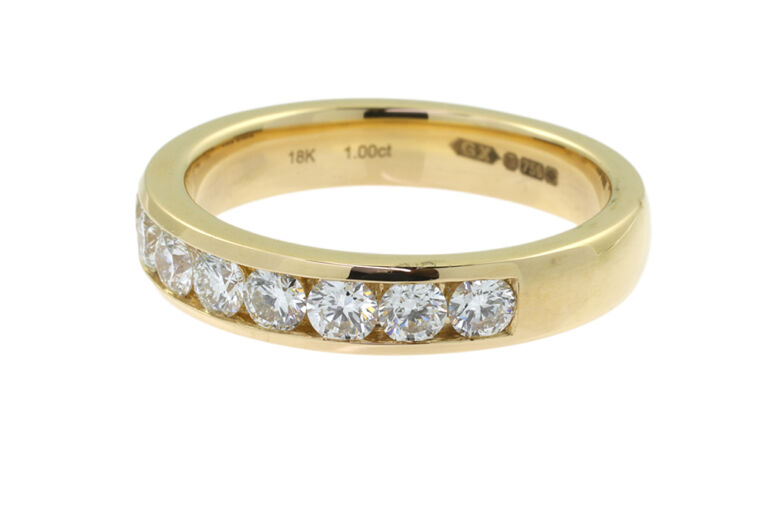 Diamond Half Eternity Ring 18ct gold Size: P.